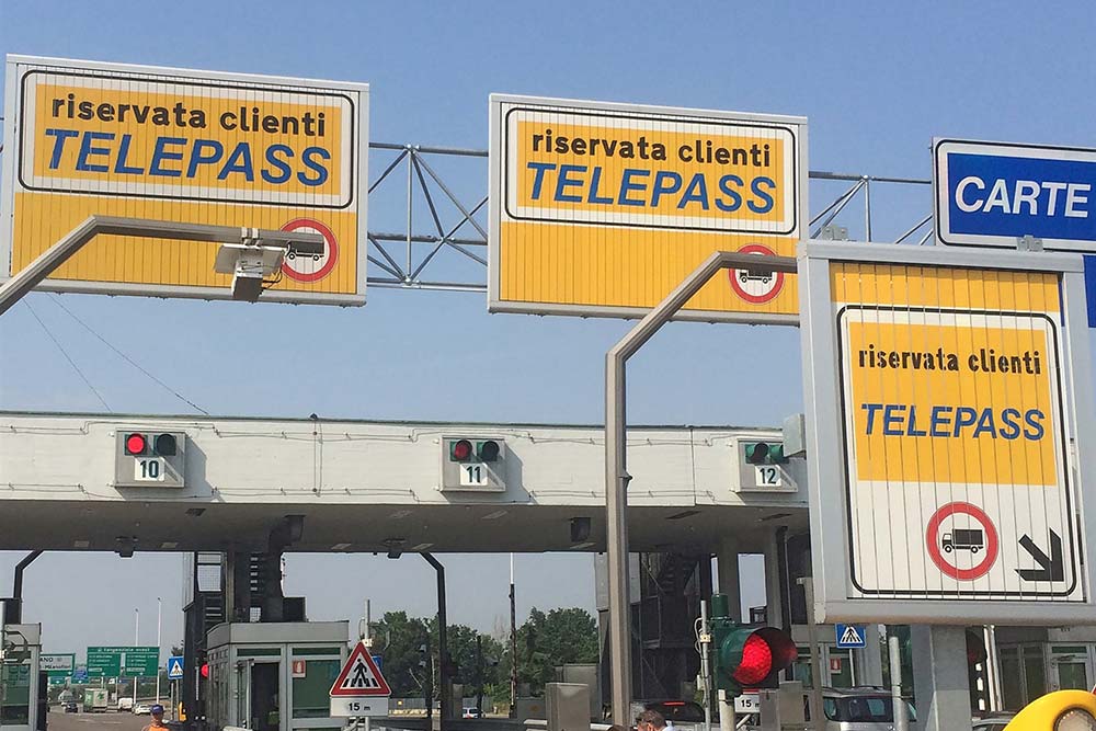 Signage for tolls above a road